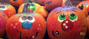 Pumpkins with faces painted on them