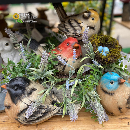 Bird & Wildlife Suppliesdecorative birds in a display with artificial greenery and a nest 