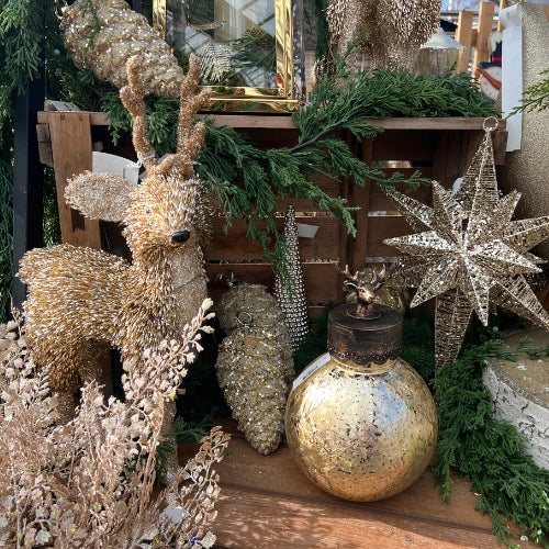 gold tinsel and glitter deer with gold glitter star, pinecones, picks and glass battery operated orb light