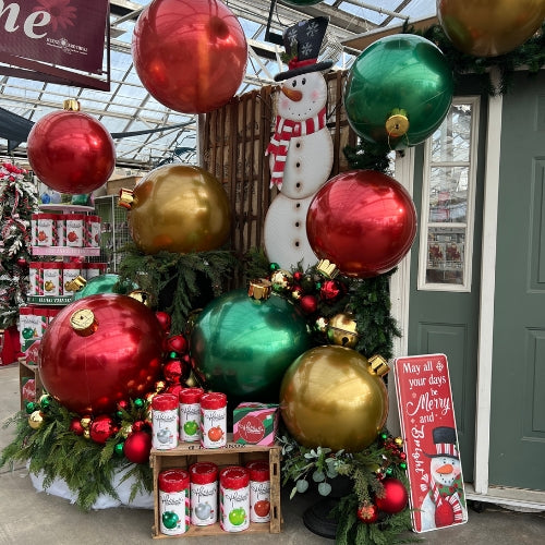 large blow up ornaments red green and gold